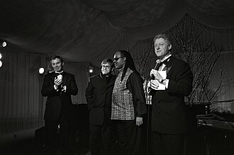 John (second from left) alongside British Prime Minister Tony Blair (left), the singer-songwriter Stevie Wonder and US President Bill Clinton at the White House in Washington, D.C., February 1998