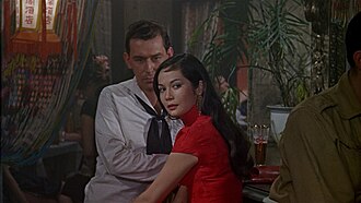 The prostitute Suzie Wong (Nancy Kwan) working a sailor to earn her keep. (The World of Suzie Wong, 1960)