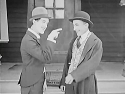 One year after launching his film career, Laurel (left) became the co-star of Frauds and Frenzies with Larry Semon (1918).