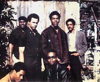 Original six members of the Black Panther Party (1966): Top left to right: Elbert "Big Man" Howard, Huey P. Newton (Defense Minister), Sherwin Forte, Bobby Seale (Chairman); Bottom: Reggie Forte and Little Bobby Hutton (Treasurer).
