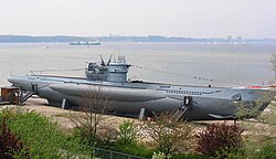 U-995, Type VIIC/41 U-boat of World War II, showing the ship-like lines of the outer hull for surface travel, blended into the cylindrical pressure hull structure