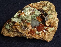 Spessartine (the reddish mineral)