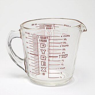 A PYREX 1-quart measuring cup, featuring graduations in United States customary units