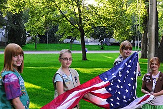 Girl Scouts raising the flag at a Municipal Band concert in Eau Claire, Wisconsin