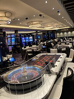 A casino on the Norwegian Cruise Line ship Bliss. Casinos are commonly found on board cruise ships.