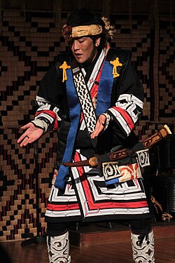 Ainu man performing a traditional Ainu dance