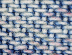 Microscopic image of faded fabric
