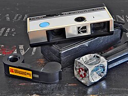 Kodak Instamatic 192, a typical 110-format pocket camera, with 110 film and "Magicube" flash cartridge (with extender)