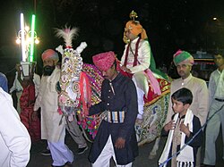 Bridegroom arrives on horseback at a Rajput wedding.
