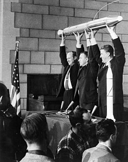 William Hayward Pickering, James Van Allen, and von Braun display a model of Explorer 1 at a news conference after confirmation the satellite was in orbit.