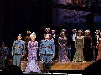 Te Kanawa with the cast of La fille du régiment at the Metropolitan Opera, 24 December 2011