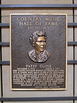 Cline's plaque is located inside the Country Music Hall of Fame and Museum. She was the first female solo artist inducted into that hall.