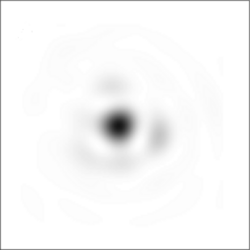 Simulated negative image showing what a single (point-like) star would look like through a ground-based telescope with a diameter of 2r0. The blurred look of the image is because of diffraction, which causes the appearance of the star to be an Airy pattern with a central disk surrounded by hints of faint rings. The atmosphere would make the image move around very rapidly, so that in a long-exposure photograph it would appear more blurred.