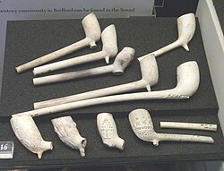 A group of English clay pipes, from the early 17th to late 19th century, none complete, Bedford Museum, 2010