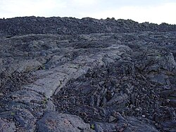 ʻAʻā next to pāhoehoe lava at the Craters of the Moon National Monument and Preserve, Idaho, United States.