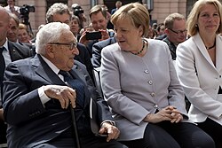 Kissinger with German chancellor Angela Merkel on June 21, 2017