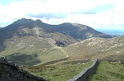 The Mountains of Mourne inspired Lewis to write The Chronicles of Narnia. About them, Lewis wrote "I have seen landscapes ... which, under a particular light, make me feel that at any moment a giant might raise his head over the next ridge."[95]