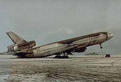 A DC-10-30 resting on its tail due to Pinatubo ashfall