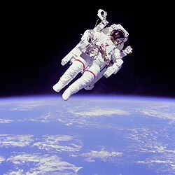 NASA astronaut Bruce McCandless II using a Manned Maneuvering Unit outside Space Shuttle Challenger on shuttle mission STS-41-B in 1984.