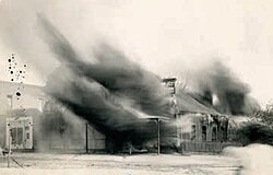 An image of the photography studio of C S. and Mollie Fly burning in 1912, taken by Mollie Fly.