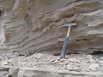 Claystone deposited in Glacial Lake Missoula, Montana, United States. Note the very fine and flat bedding, common for deposits coming from lake beds further away from the source of sediment.