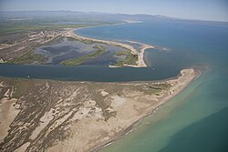 Aerial picture of the Ebro river as it reaches the Mediterranean Sea by the Ebro Delta