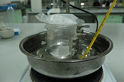 Experimental set up for the sublimation reaction of naphthalene, solid naphthalene sublimes and form the crystal-like structure at the bottom of the watch glass