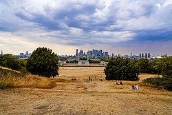 Scorched grass in Greenwich Park, London, England, during a heatwave in August 2022