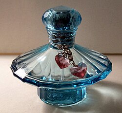 Bottle of one of Spears's several perfumes, Curious, released through Elizabeth Arden, Inc.