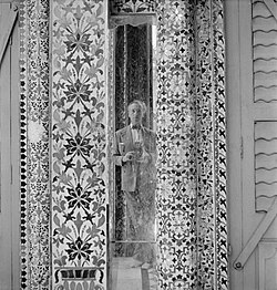 Beaton's self-portrait with his Rolleiflex reflected in a mirror of the Jain temple, Calcutta, India, 1944