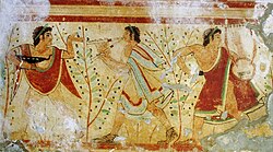 Etruscan painting of dancer and musicians from the Tomb of the Leopards in Tarquinia