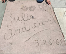 Julie Andrews's signature, handprints, and footprints in the concrete in front of Grauman's Chinese Theatre in Los Angeles.
