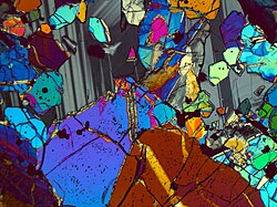 Thin section of Apollo 12 Oceanus Procellarum sample 12005 in cross polarized light showing Lunar minerals