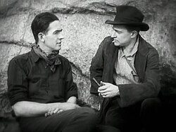 Cooper (right) alongside Ernest Schoedsack in a scene from Grass (1925).
