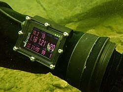 Dive computer showing three oxygen cell readings from a CCR in the middle row