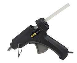 A glue gun, an example of a hot adhesive
