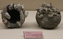 Stoneware bombs, known in Japanese as Tetsuhau (iron bomb), or in Chinese as Zhentianlei (thunder crash bomb), excavated from the Takashima shipwreck, October 2011, dated to the Mongol invasions of Japan (1274–1281 AD)