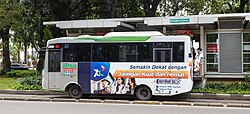 Indonesian language used on a Kopaja bus advertisement