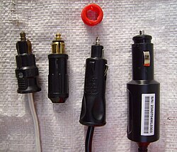 Comparison of (L to R) two Powerlet plugs, one combination plug, and one Cigar Lighter Plug