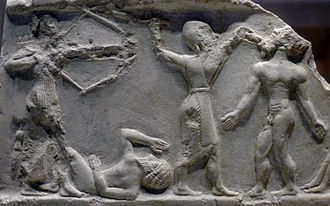 Akkadian soldiers slaying enemies, circa 2300 BC, possibly from a Victory Stele of Rimush.[65]
