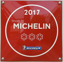 Michelin three stars, at the entrance of a restaurant