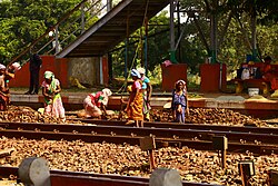 Poor women working on a railway track