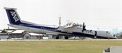 All Nippon Airways Flight 1603, a Bombardier Dash 8 Q400, resting on its nose at Kōchi Airport after its nose gear failed to deploy prior to landing, 13 March 2007