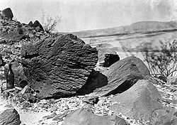 Rock carved by drifting sand below Fortification Rock in Arizona (photo by Timothy H. O'Sullivan, USGS, 1871)