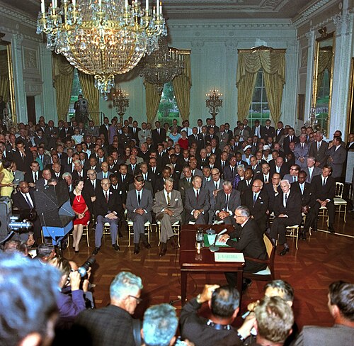 U.S. president Lyndon B. Johnson speaks to a television camera at the signing of the Civil Rights Act in 1964.