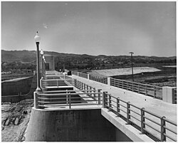 Westerly view along the top of the spillway showing the completed service bridge and handrails.