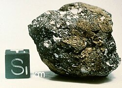 Meteorite next to a 1 cm sided cube. Found by ANSMET in the 1981-82 season. A Lunar meteorite