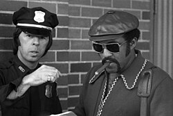 Pitcher Luis Tiant smoking a cigar outside Fenway Park in the 1970s