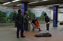 Musicians perform in the Delancey Street/Essex Street station in 2011.