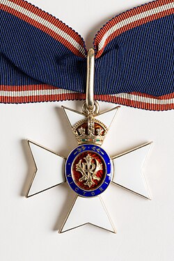 The neck badge of a Commander of the Royal Victorian Order. Chesshyre held this honour from 2003 until 2018.